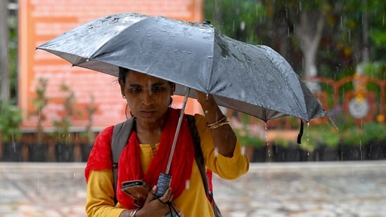 Noida, India-March 27, 2026:Commuters stepped out in Sector 19 amidst light afternoon rain, in Noida, India, on Friday, March 27, 2026. (Sunil Ghosh/HT photo)