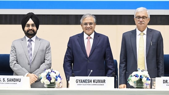 Chief Election Commissioner Gyanesh Kumar, centre front, with Election Commissioners S S Sandhu, left, and Vivek Joshi, right front, during a press conference. (Sanjeev Verma/HT)