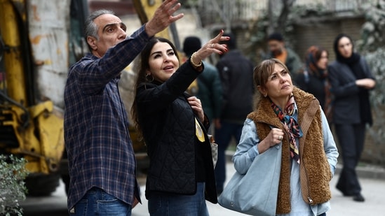 People look at the damage at the site of a strike on a residential building, amid the US-Israeli conflict with Iran, in Tehran on March 23, 2026. (Photo: Majid Asgaripour/WANA via Reuters)