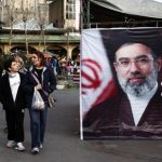 People walk next to a banner with a picture of Iran’s new Supreme Leader, Mojtaba Khamenei, at Tajrish Bazaar, ahead of Nowruz, the Iranian New Year, amid the US-Israeli conflict with Iran, in Tehran on March 19, 2026. (Photo: Majid Asgaripour/WANA via Reuters)