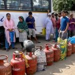 People queue up to avail LPG cylinders amid ongoing supply crunch, in Dilshad Colony, Delhi. (PTI)