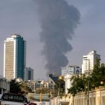 A tall smoke plume billows following an explosion in the Fujairah industrial zone on March 3, 2026. (AFP)