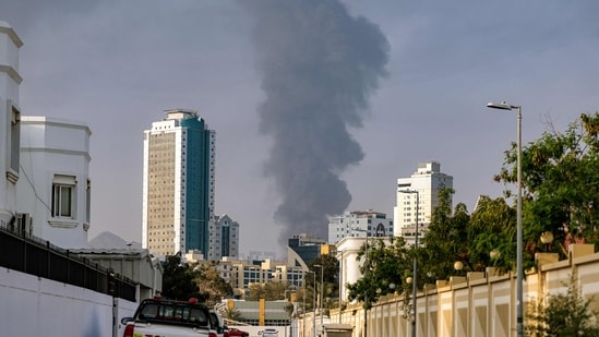 A tall smoke plume billows following an explosion in the Fujairah industrial zone on March 3, 2026. (AFP)