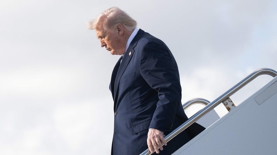 Trump sparks fresh health fears as he appears to struggle down Air Force One stairs (Photo by SAUL LOEB / AFP) (AFP)