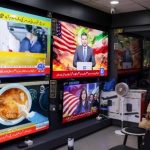 A man sits next to televisions at a shop in Karachi showing news regarding the peace talks to be held in Islamabad by delegations from the United States and Iran on April 11, 2026. (Insiya Syed/Reuters Photo)