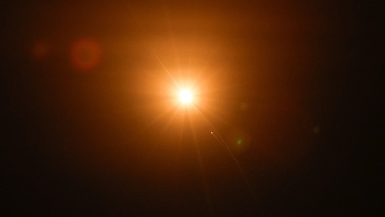 An Israeli air-defence system intercepts an Iranian missile flying towards Israel (REUTERS)