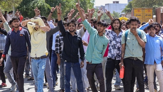 Factory workers during a protest demanding a hike in wages, in Noida, Gautam Buddh Nagar district, Uttar Pradesh, Monday, April 13, 2026. The protest carried incidents of arson, vandalism and stone-pelting reported from Phase-2 and Sector 60 areas, police said. (PTI)