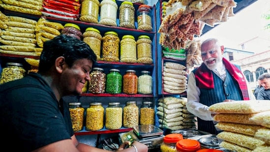 Prime Minister Narendra Modi buys jhalmuri, a street snack, in Jhargram on April 19. (Video grab: X/@narendramodi)