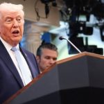 President Donald Trump, flanked by Secretary of Defense Pete Hegseth, speaks during a press conference (REUTERS)