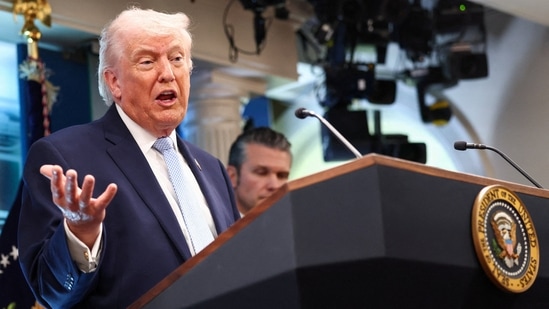 President Donald Trump, flanked by Secretary of Defense Pete Hegseth, speaks during a press conference (REUTERS)