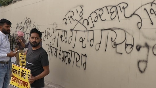 Aam Aadmi Party workers staging a protest outside the residence of MP Rajinder Gupta, owner of Trident Group, following his political shift to the BJP. The AAP workers wrote ‘gaddar’ (traitor) on the main gate of the house, on Saturday, April 25, 2026. (Gurpreet Singh/HT Photo)